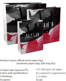 Glossy cardboard luxury paper garment carrier bag wholesale,Medium luxury shopping paper carrier gift bag wholesale